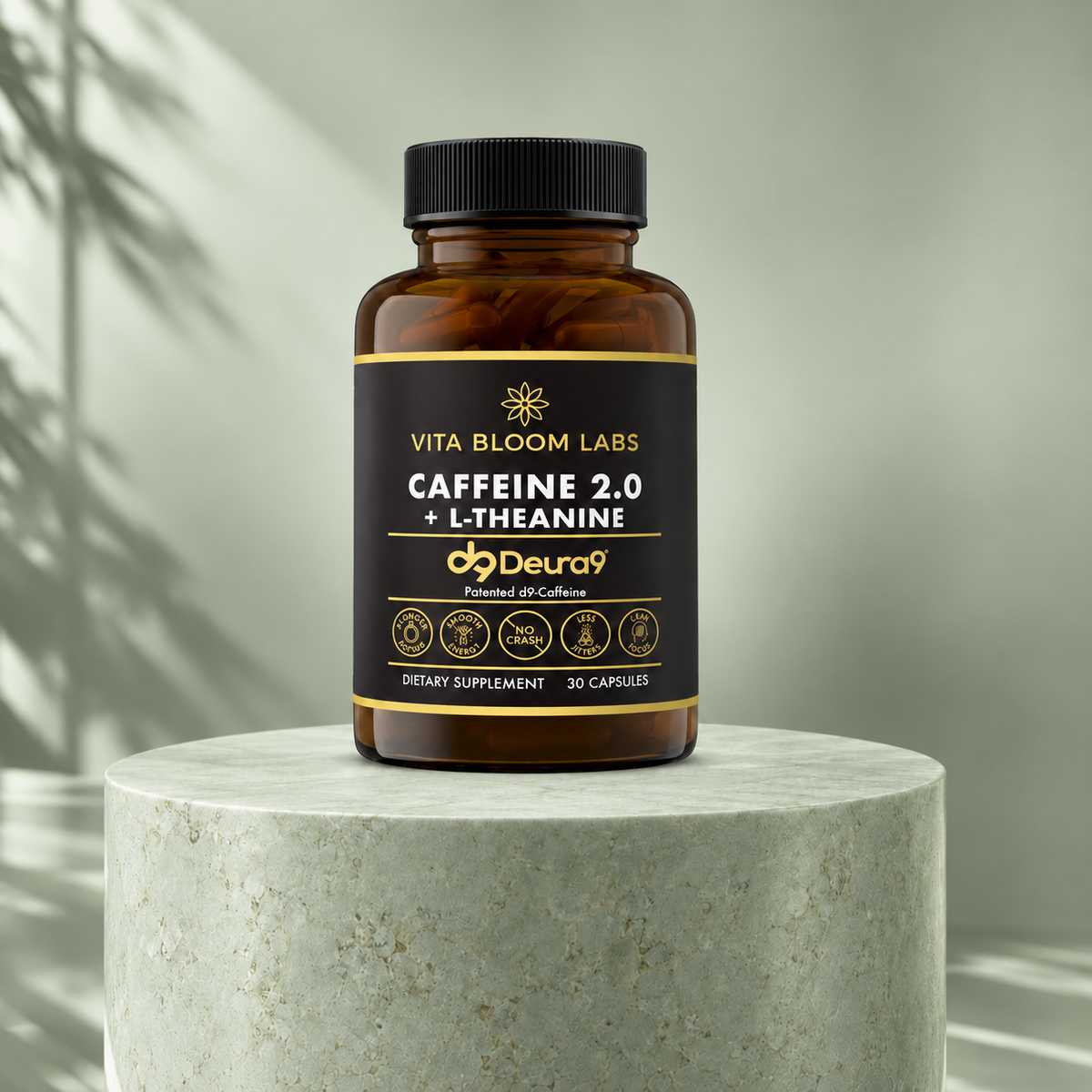 Vita Bloom Labs Caffeine 2.0 + L-Theanine front bottle on a sage green stone pedestal with a sage backdrop and soft leaf shadows.
