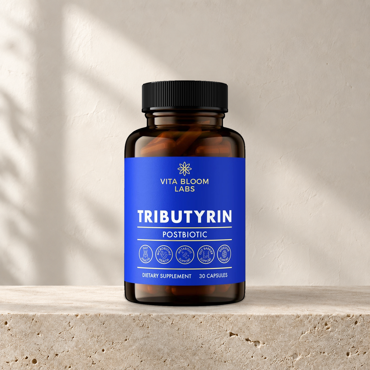 Vita Bloom Labs Tributyrin Postbiotic bottle on pale limestone in soft natural light.