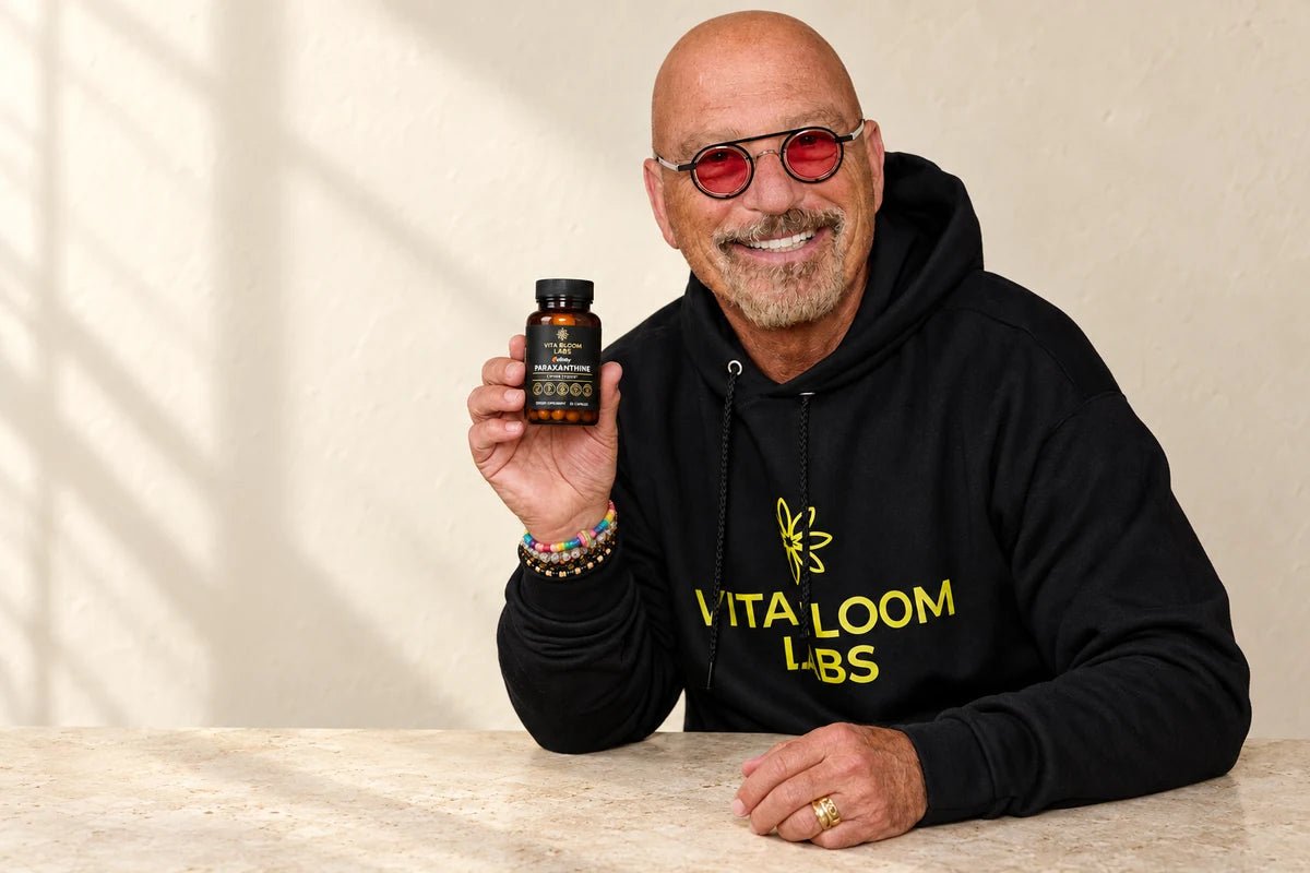 Howie Mandel holding Enfinity Paraxanthine